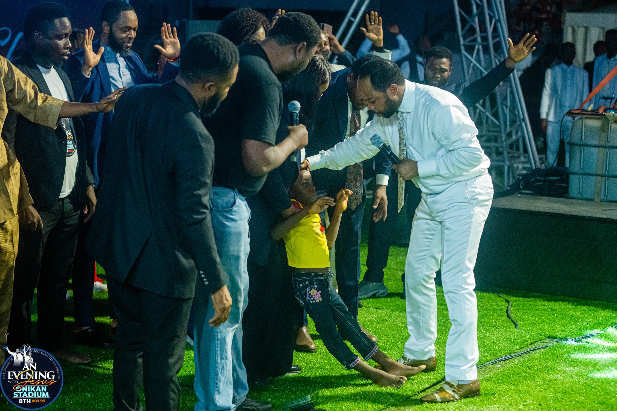 A young girl walking on stage after being prayed for